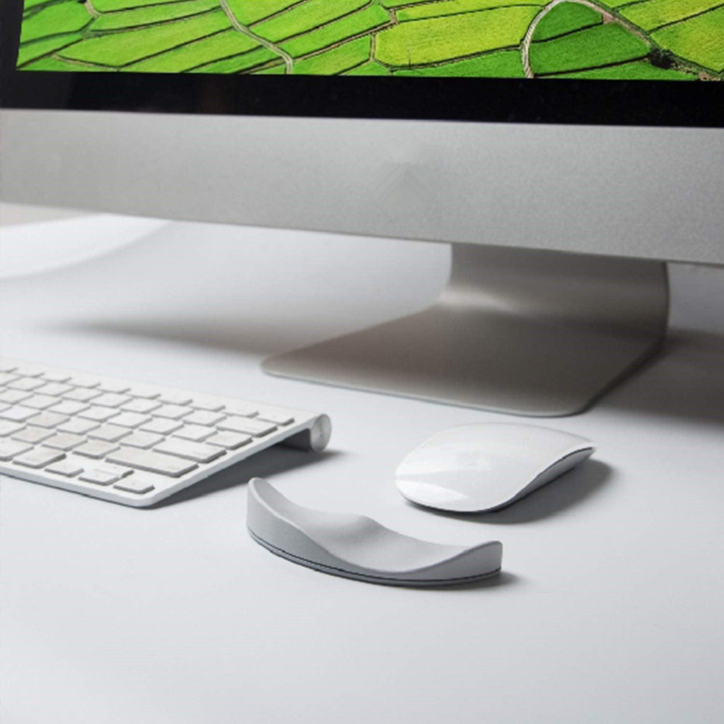 Ergonomic gliding silicone mouse wrist rest pad in black, providing comfortable desk and workstation support — view 3