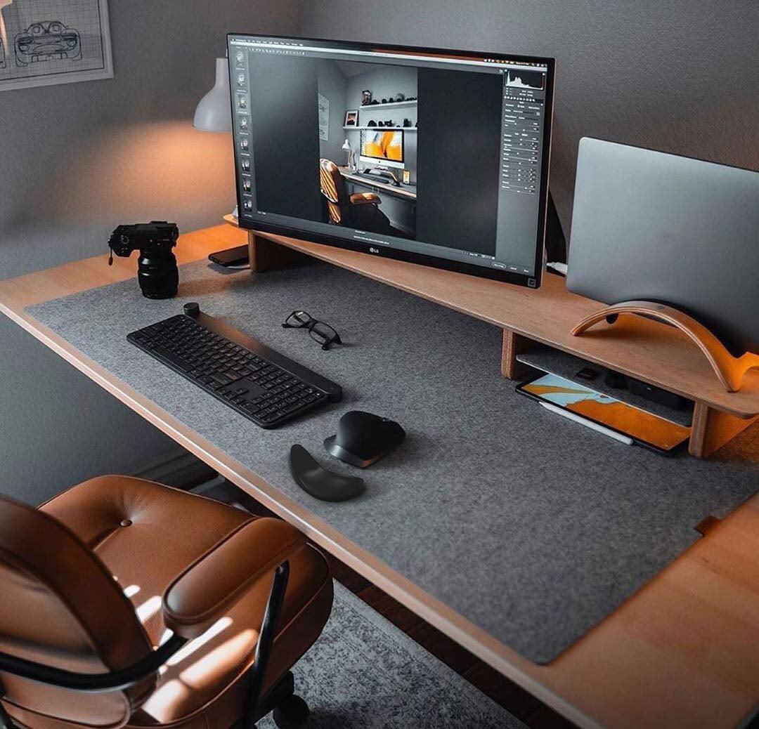 Ergonomic gliding silicone mouse wrist rest pad in black, providing comfortable desk and workstation support — view 4