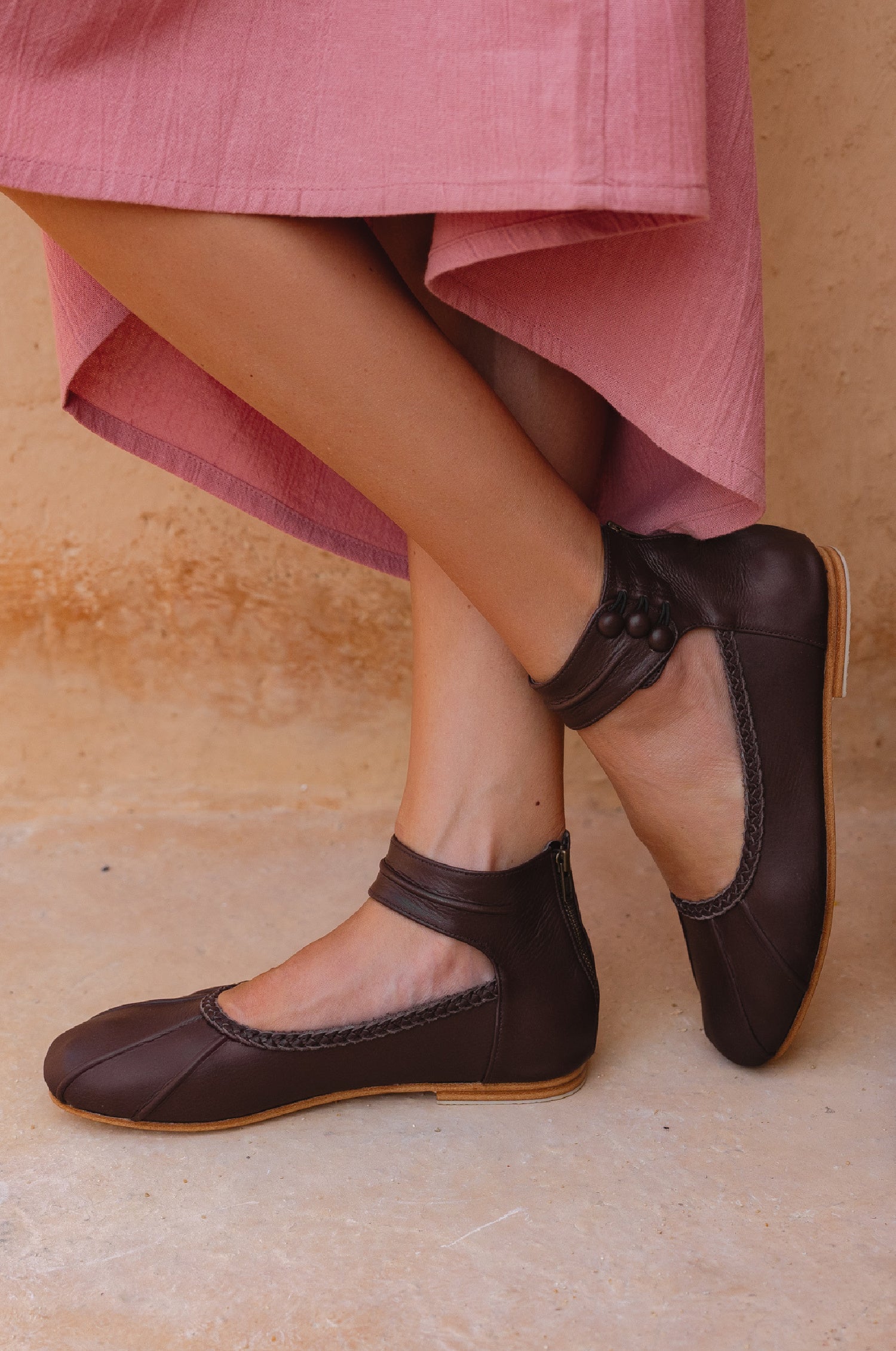 Muse ankle strap leather ballet flats in brown with back zipper and rubber outsole.
