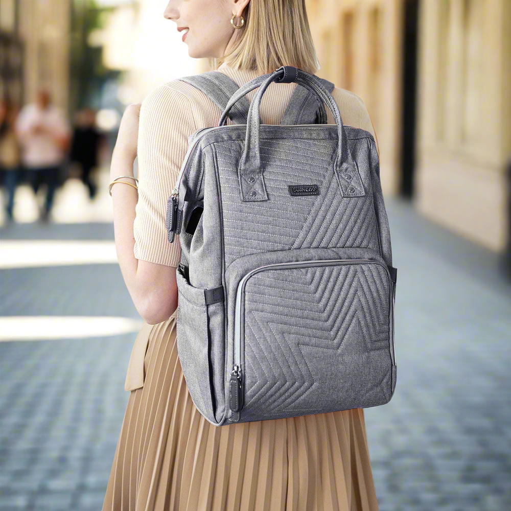 Quilted diaper bag backpack in waterproof oxford fabric with portable changing pad and stroller straps — view 3