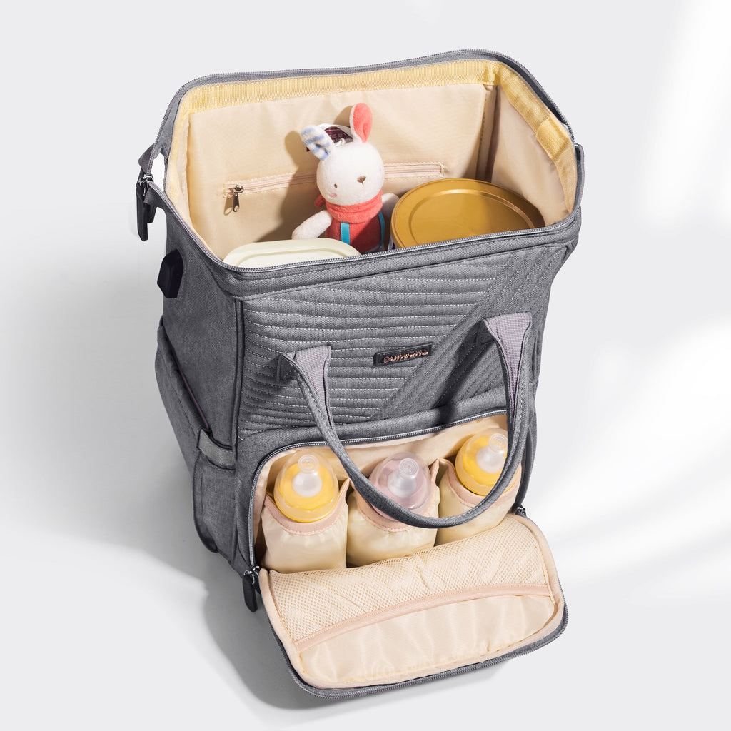 Quilted diaper bag backpack in waterproof oxford fabric with portable changing pad and stroller straps — view 4