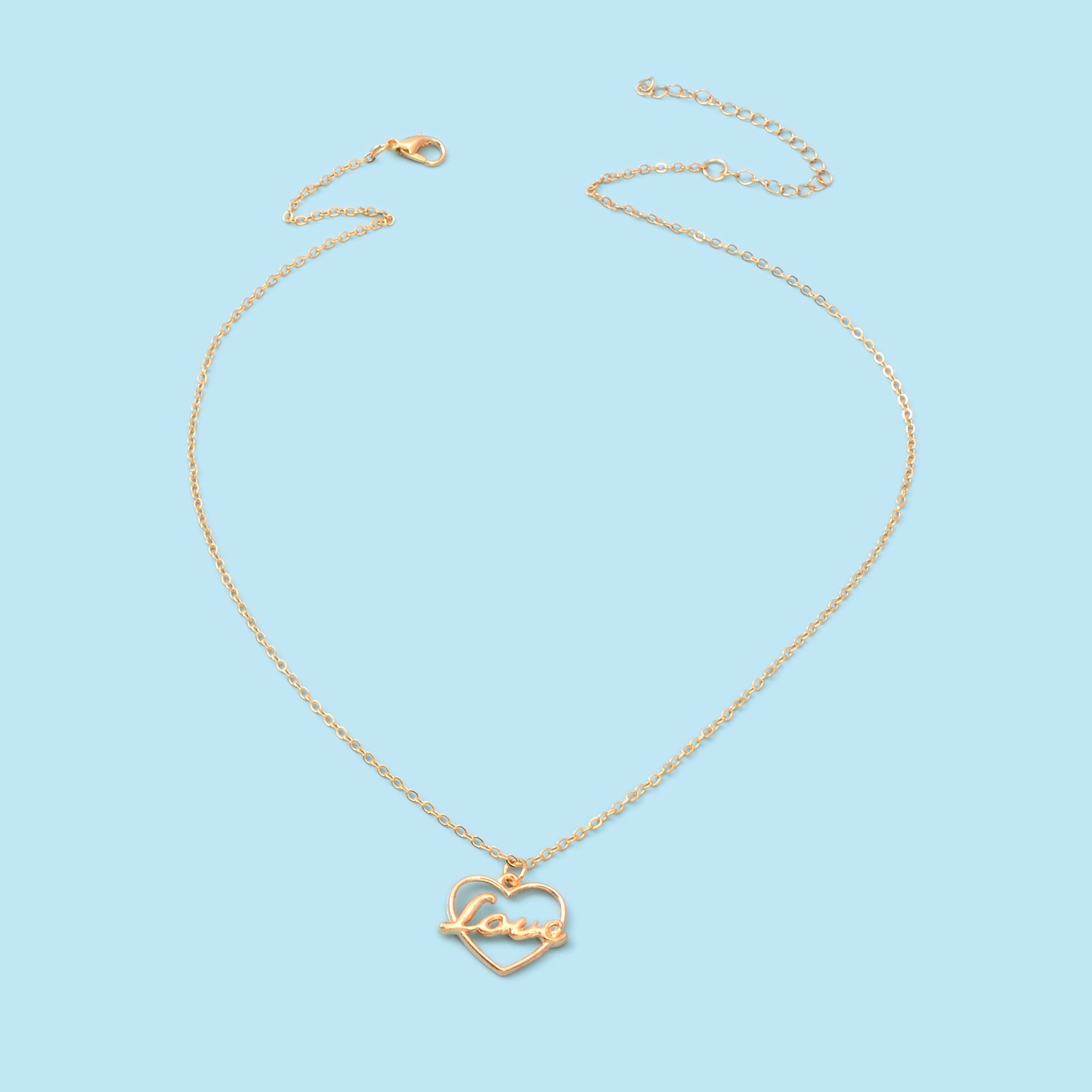 Gold-tone LOVE letter pendant necklace with a delicate heart motif on a classic link chain — view 3