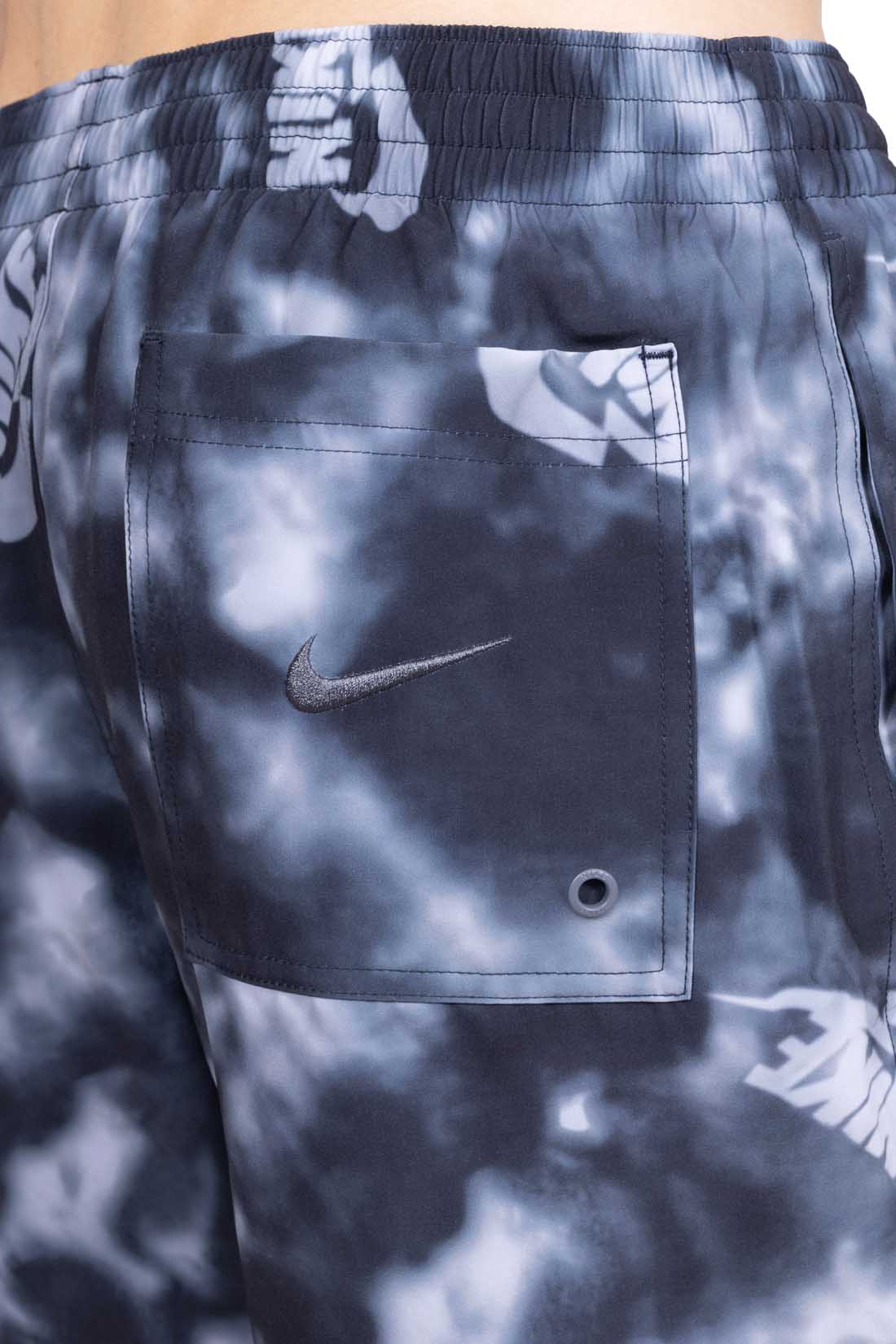Nike men's grey swim shorts with all-over logo print, elastic waistband, and side pockets. — view 16