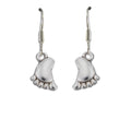 Silver baby foot drop earrings with sterling silver hooks resting gracefully on a white background