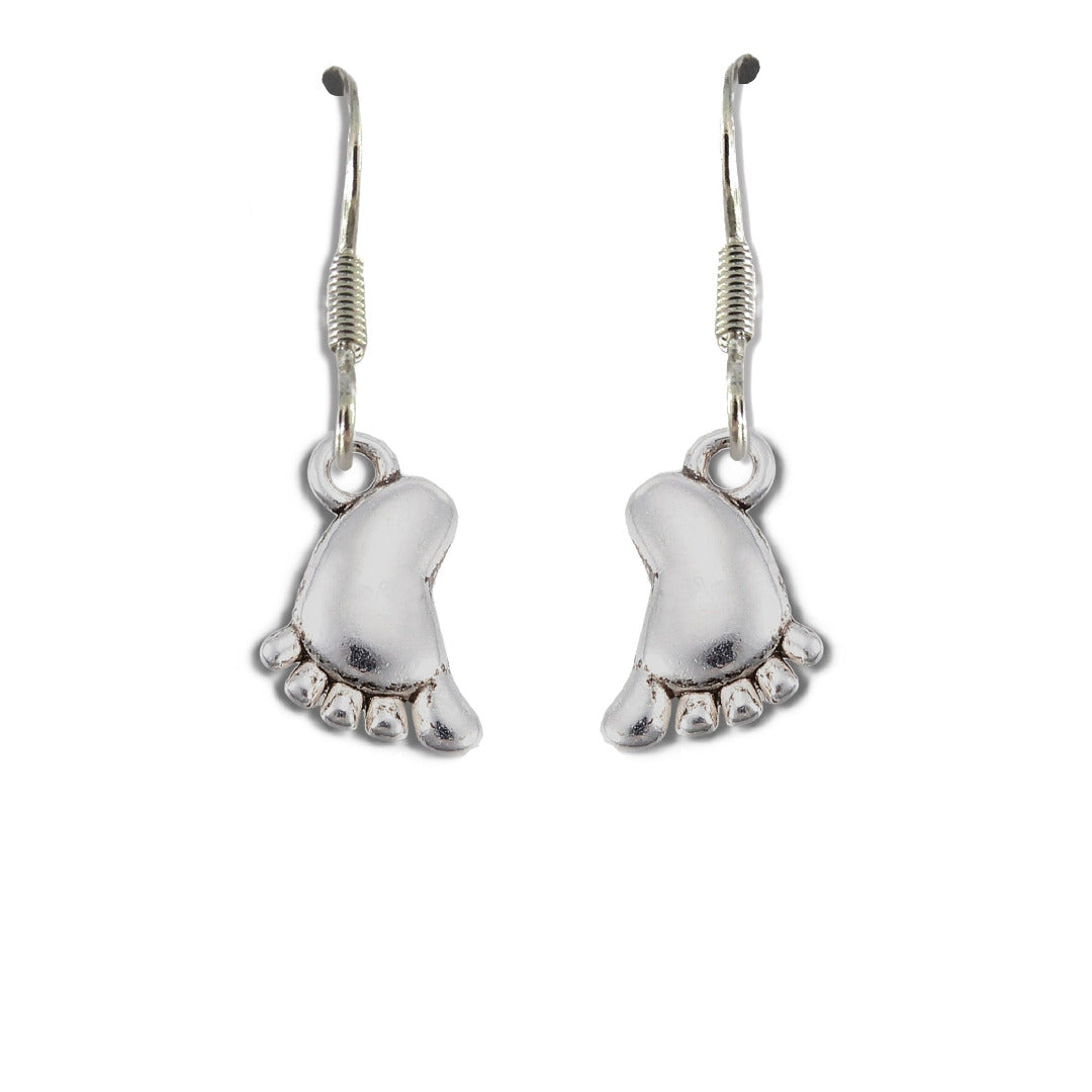 Silver baby foot drop earrings with sterling silver hooks resting gracefully on a white background
