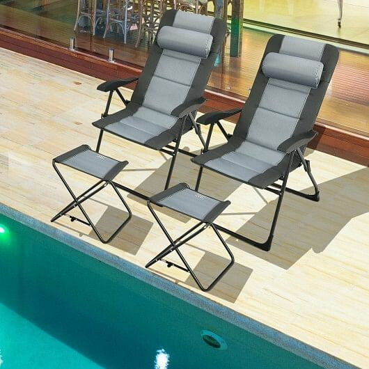 Gray folding patio dining chair with padded seat, headrest, and matching footrest ottoman