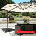 Four-piece black cantilever offset patio umbrella base with stackable design and hidden carrying handles.
