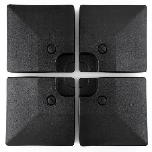 Four-piece black cantilever offset patio umbrella base with stackable design and hidden carrying handles. — view 3