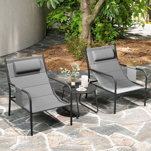 Gray three piece outdoor patio bistro set featuring two metal chairs and a coffee table