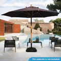 Black fillable patio umbrella base with decorative shell texture and three interchangeable adapter rings
