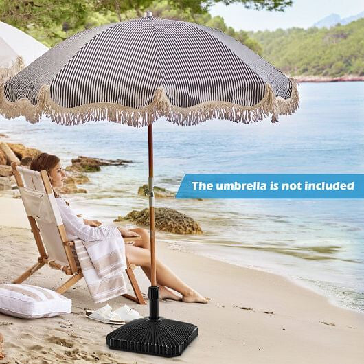 Black fillable patio umbrella base with decorative shell texture and three interchangeable adapter rings — view 4