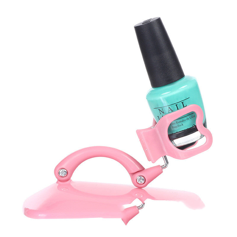 Pink nail polish fixation clip holding a bottle for a mess-free manicure experience — view 2