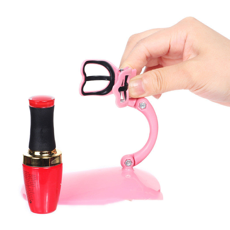 Pink nail polish fixation clip holding a bottle for a mess-free manicure experience — view 5
