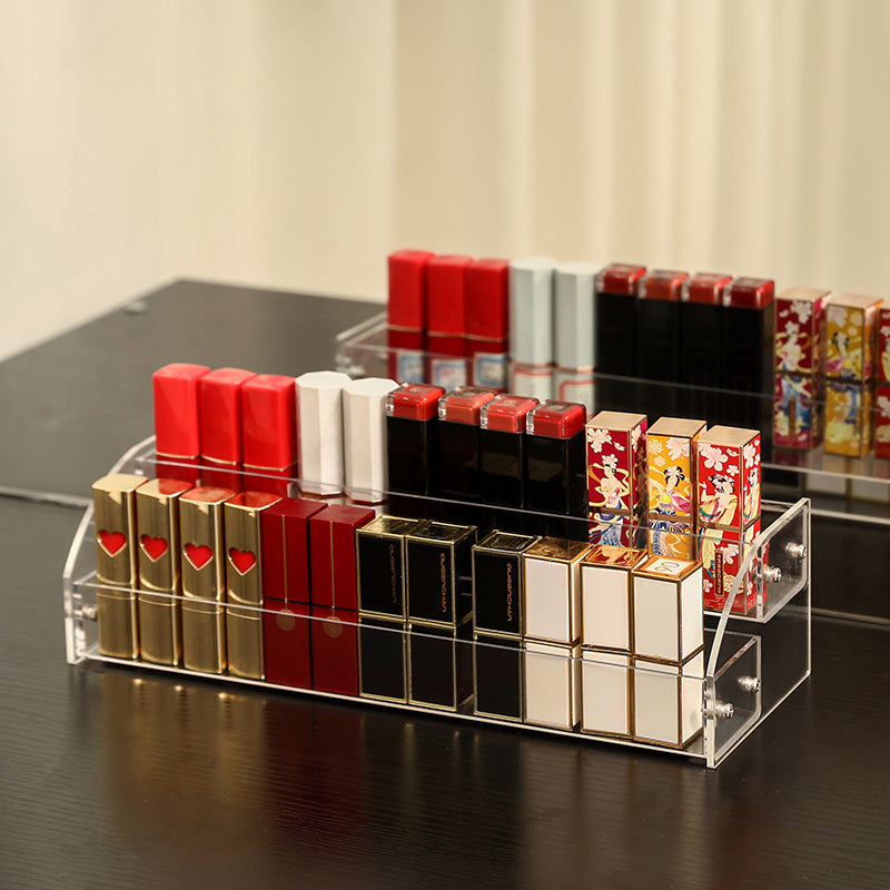Clear acrylic nail polish organizer stand holding cosmetic bottles on a vanity table