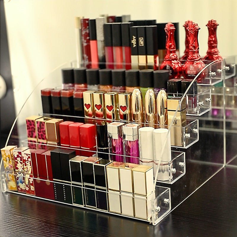 Clear acrylic nail polish organizer stand holding cosmetic bottles on a vanity table — view 5