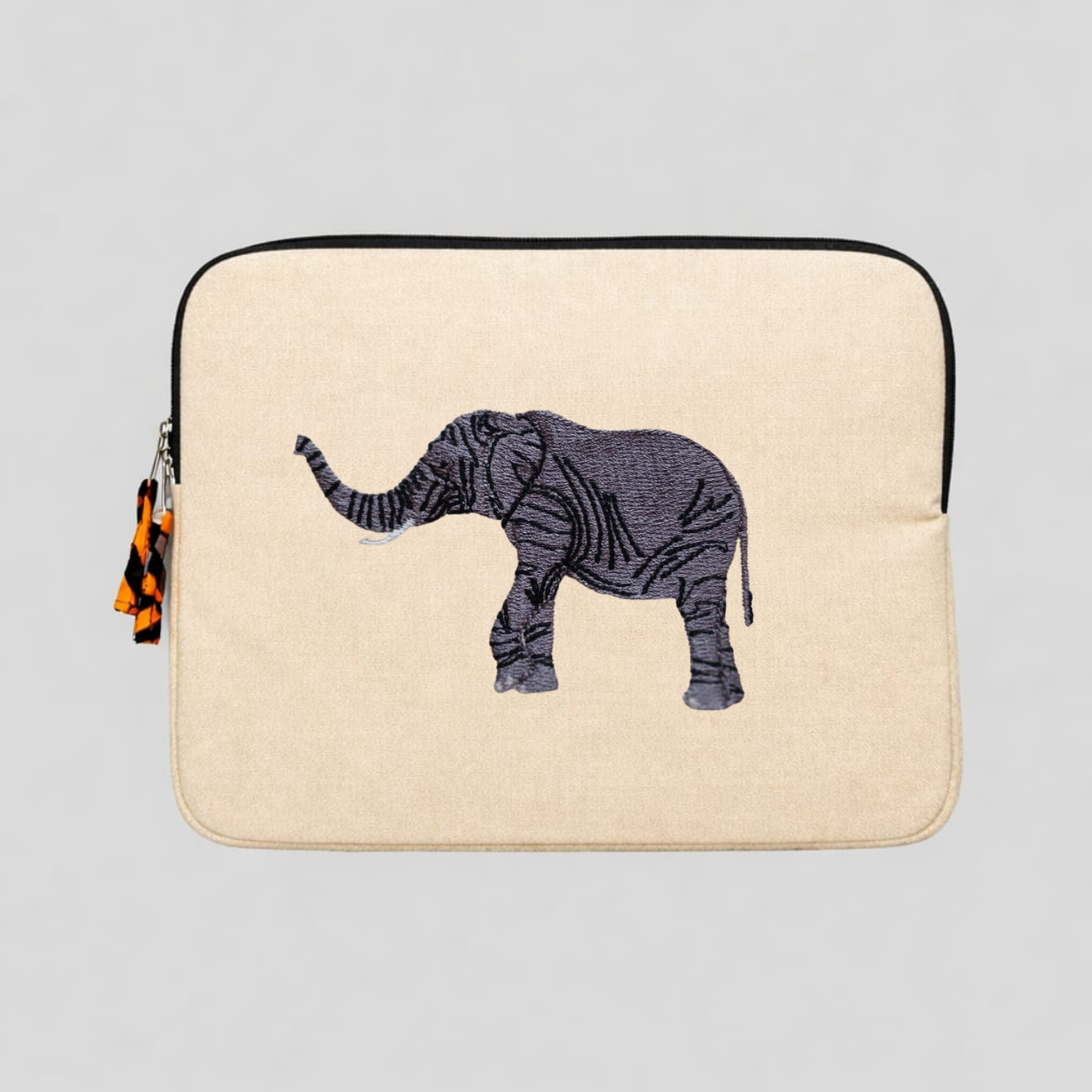 Elephant laptop sleeve in warm earthy cotton canvas with beautifully stitched savanna wildlife embroidery details. — view 3