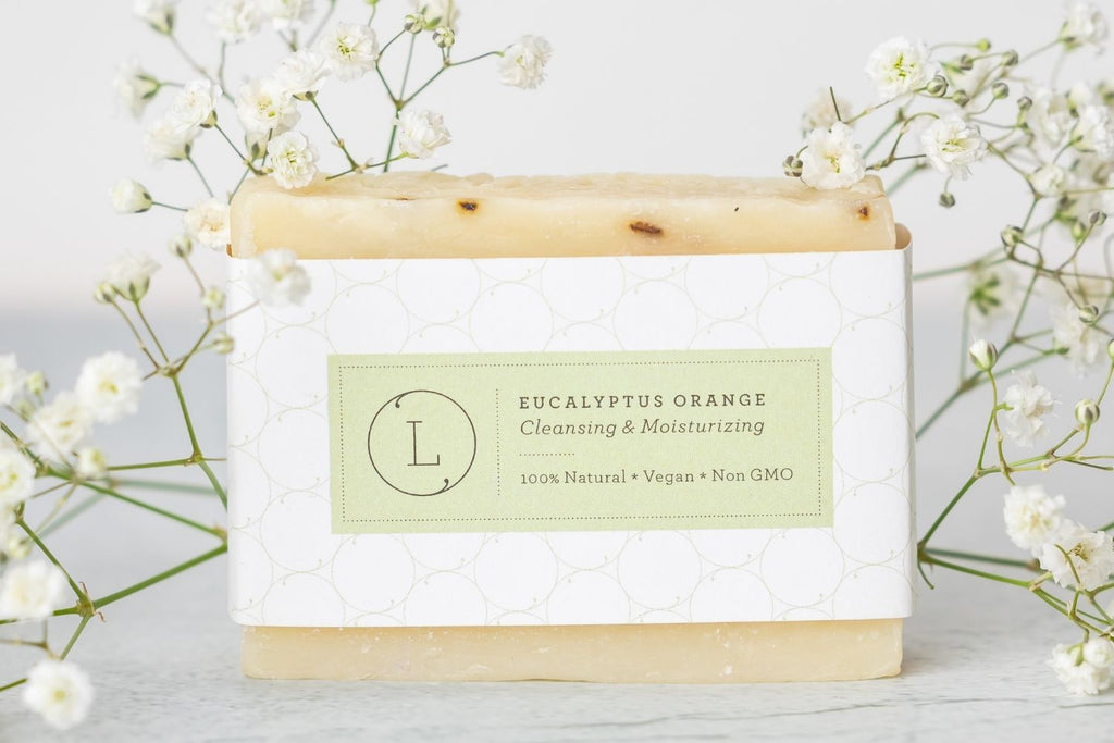 Two handmade natural eucalyptus cold process soap bars packed in a reusable cotton bag — view 4