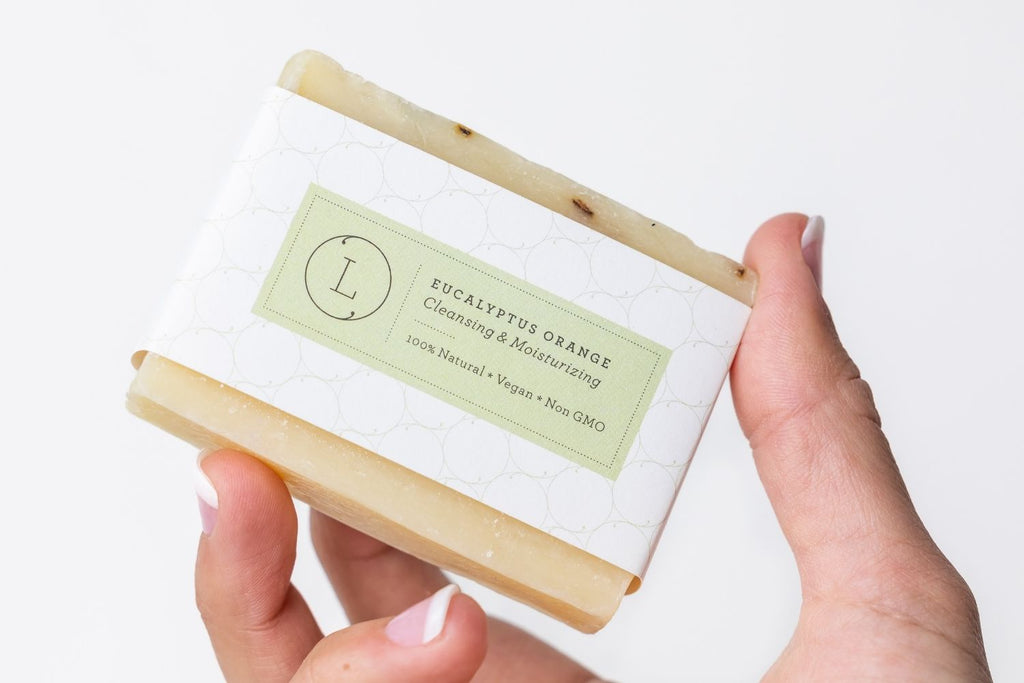 Two handmade natural eucalyptus cold process soap bars packed in a reusable cotton bag — view 5