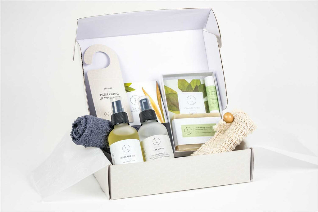 Eucalyptus spa gift box with massage oil, mist, natural soap, and towel in elegant packaging