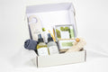 Eucalyptus spa gift box with massage oil, mist, natural soap, and towel in elegant packaging