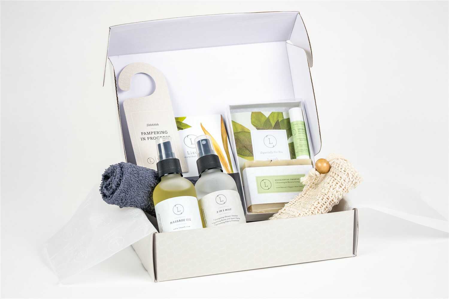 Eucalyptus spa gift box with massage oil, mist, natural soap, and towel in elegant packaging