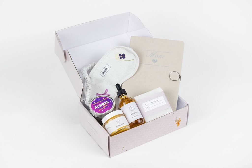 Natural pregnancy gift box with belly oil, lavender soap, journal, and cotton eye mask