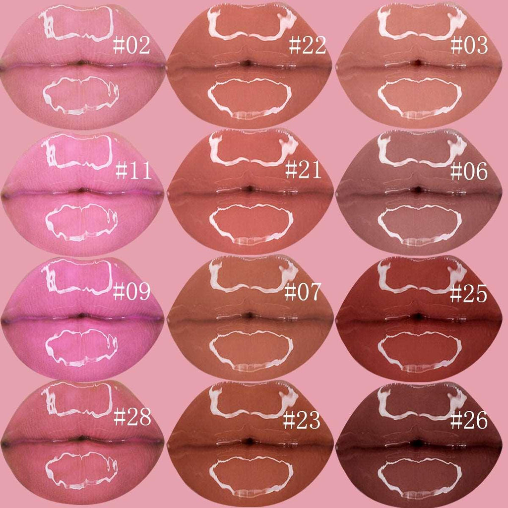 Nourishing vegan lip gloss tube in clear pink shade with wand applicator