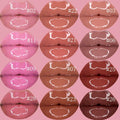 Nourishing vegan lip gloss tube in clear pink shade with wand applicator