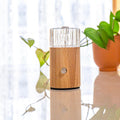 NOVA Ezy waterless essential oil diffuser with hand blown glass reservoir and natural blonde wood base