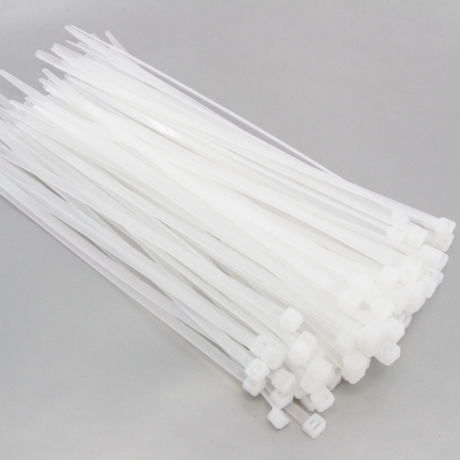 Pack of white nylon cable zip ties for secure and neat home wire management
