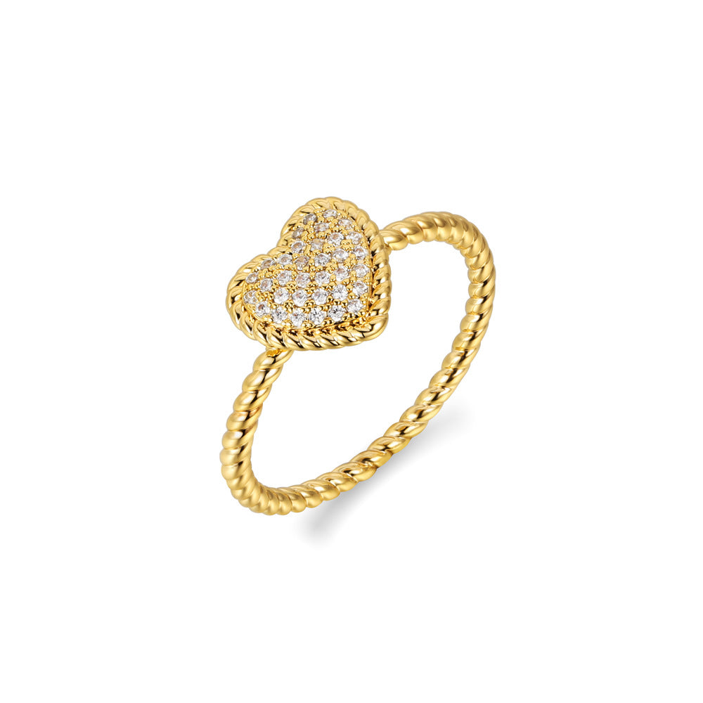 French retro love ring featuring a textured copper band and a sparkling heart shaped zircon diamond