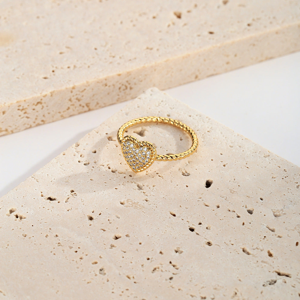 French retro love ring featuring a textured copper band and a sparkling heart shaped zircon diamond — view 4