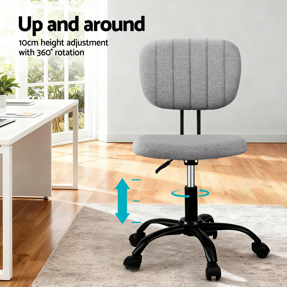 Grey fabric armless office chair with 360 degree swivel wheels and adjustable height metal base — view 4