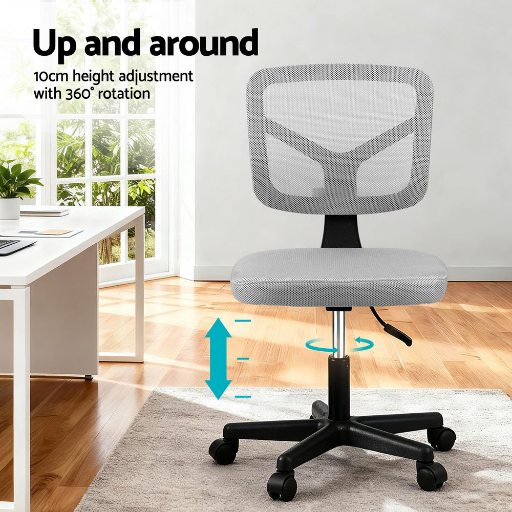 Grey ergonomic armless office chair with breathable mesh back, rolling castors, and sturdy metal base. — view 4