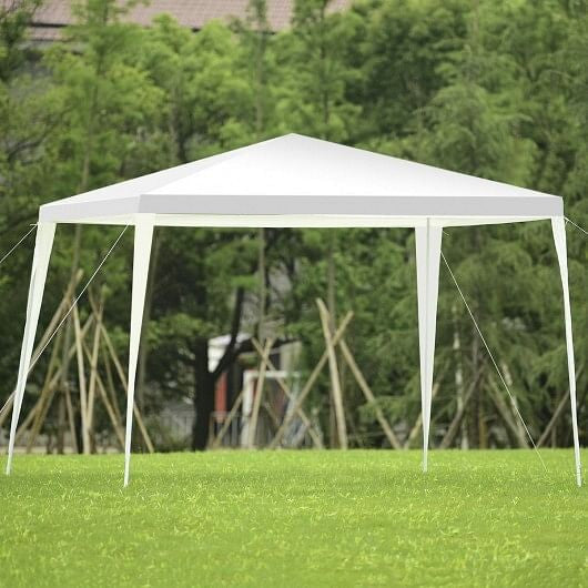 White 10x10 outdoor wedding canopy tent set up in a backyard with steel framework