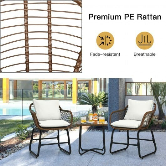 White 3-piece patio rattan bistro set with two cushioned armchairs and a square glass side table