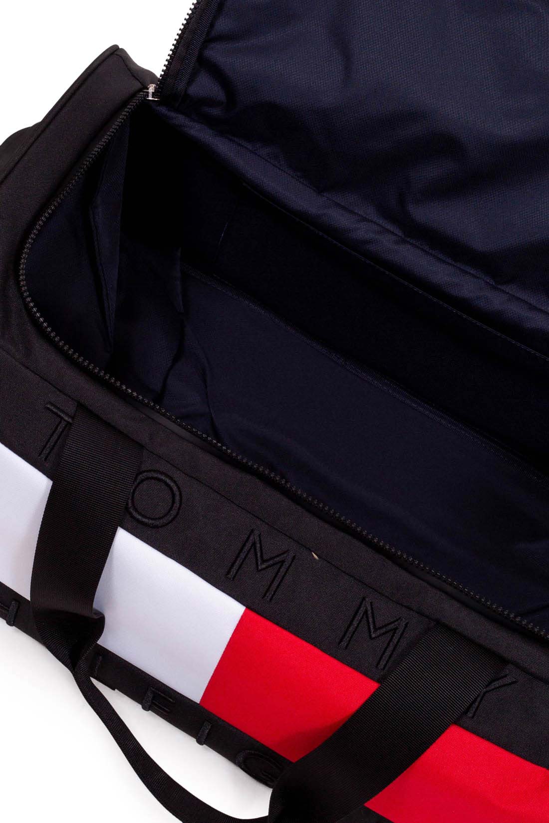 Black convertible wheeled duffel bag in recycled nylon with colorblock detail double handles and rod
