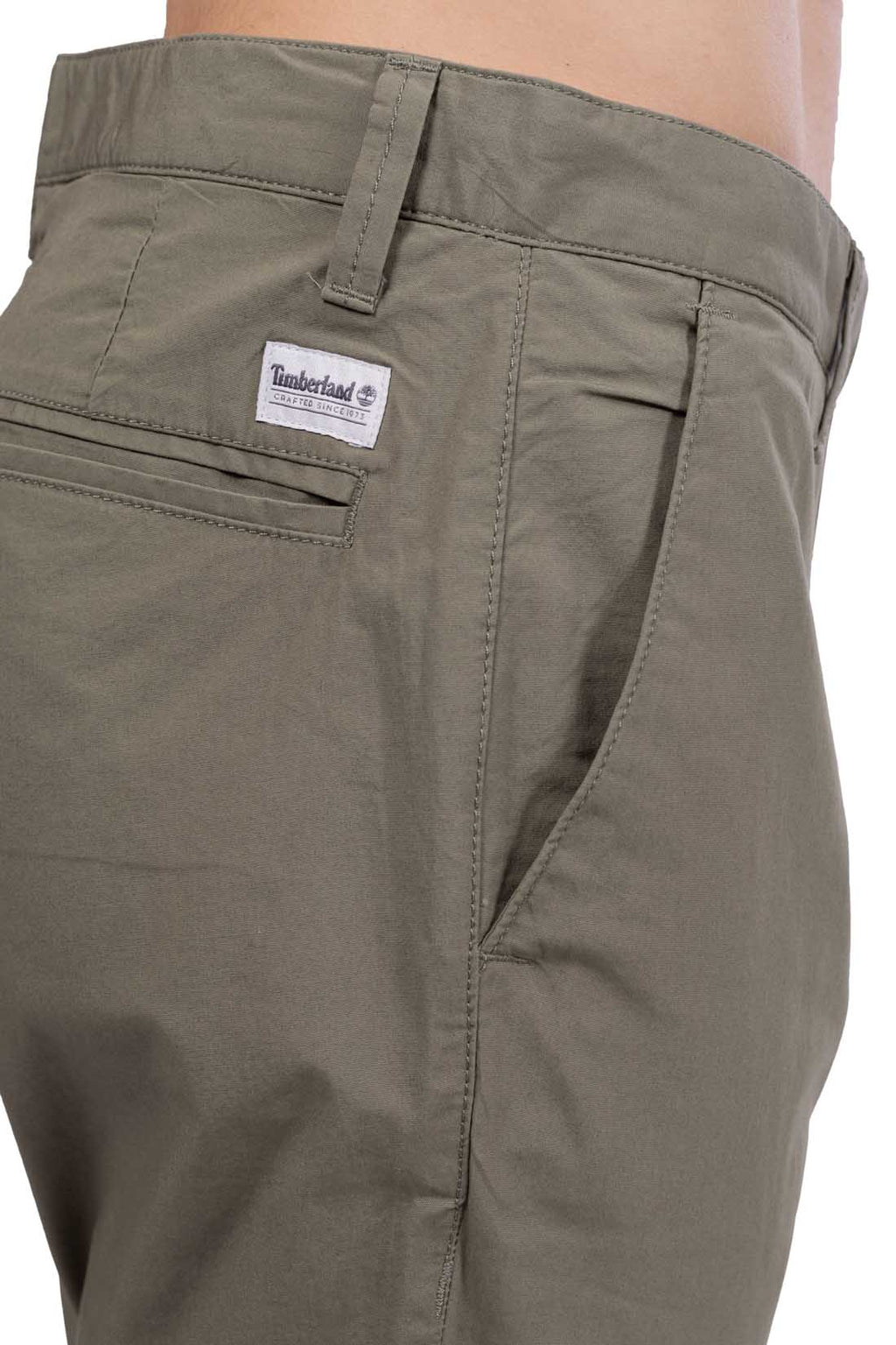 Men's military green stretch cotton chino trousers with a regular fit and back logo patch — view 9