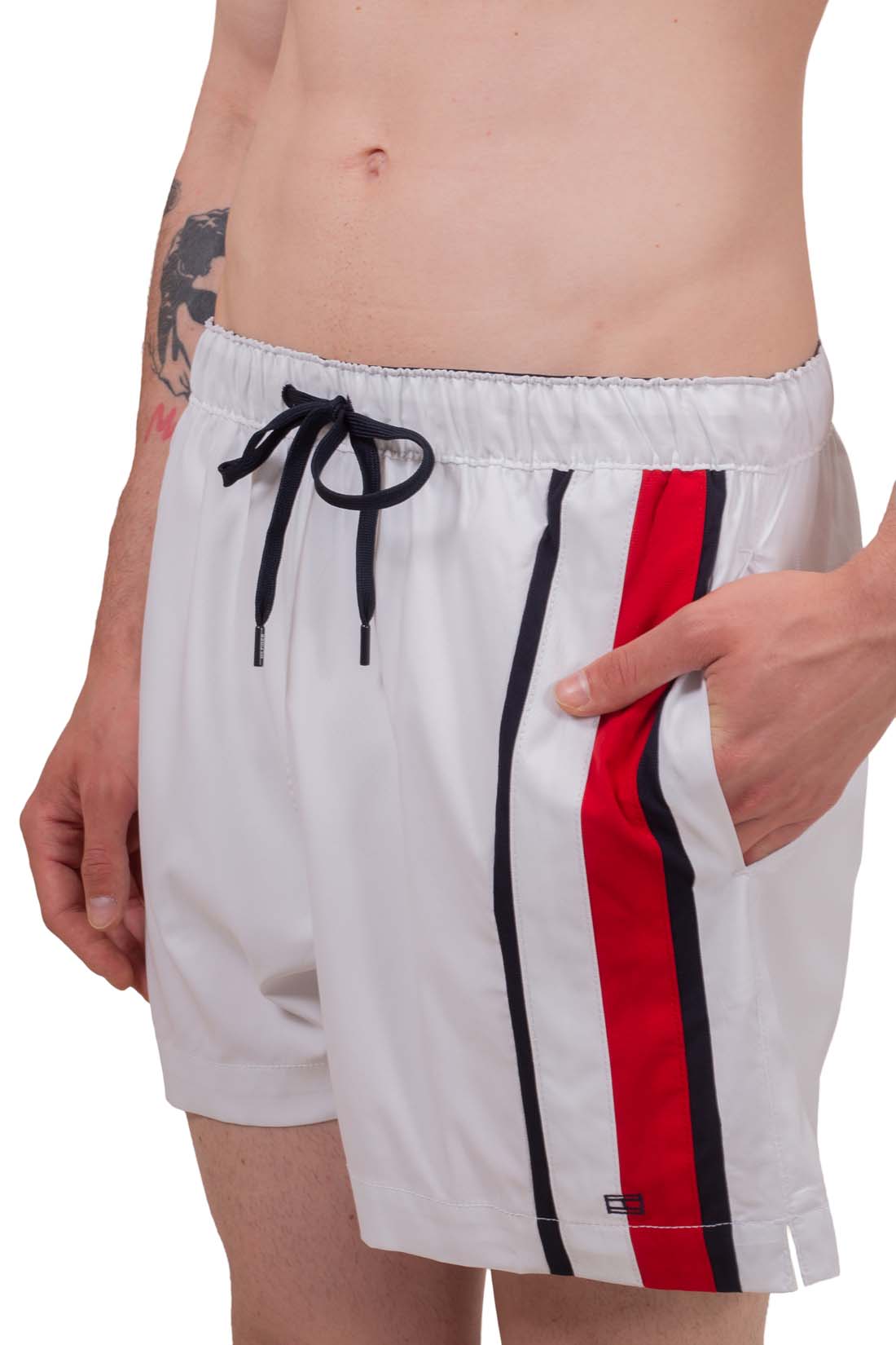 White men's swim shorts with elastic waistband, drawstring, and signature embroidered flag detail on front — view 3