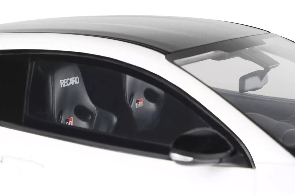 1/18 scale 2022 Toyota GRMN Yaris model car in platinum white pearl with black hood