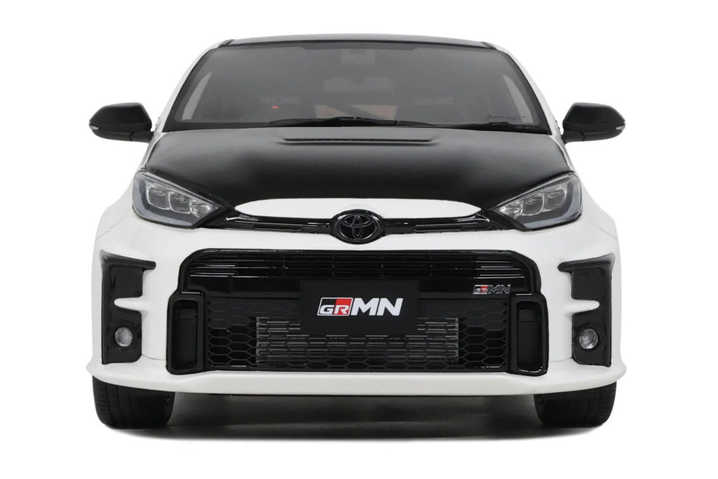 1/18 scale 2022 Toyota GRMN Yaris model car in platinum white pearl with black hood — view 3
