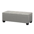Light grey faux linen tufted storage ottoman with a lift-up lid and detachable wooden legs.