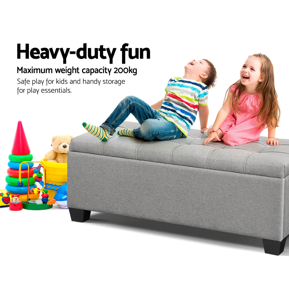 Light grey faux linen tufted storage ottoman with a lift-up lid and detachable wooden legs. — view 4