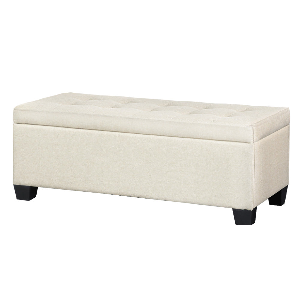 Beige faux linen storage ottoman blanket box with lifted lid revealing inner space and wooden legs