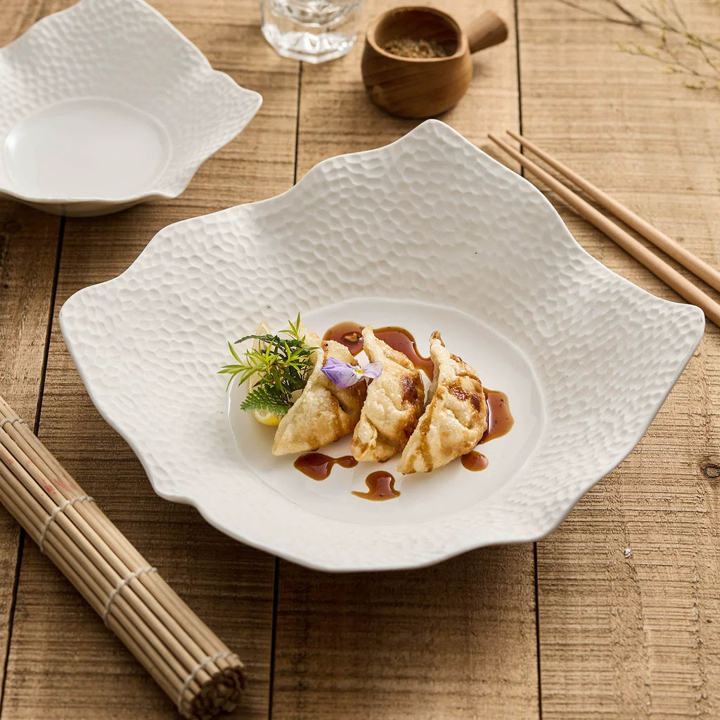 Irregular matte square plate in off white high fired ceramic with lattice surface