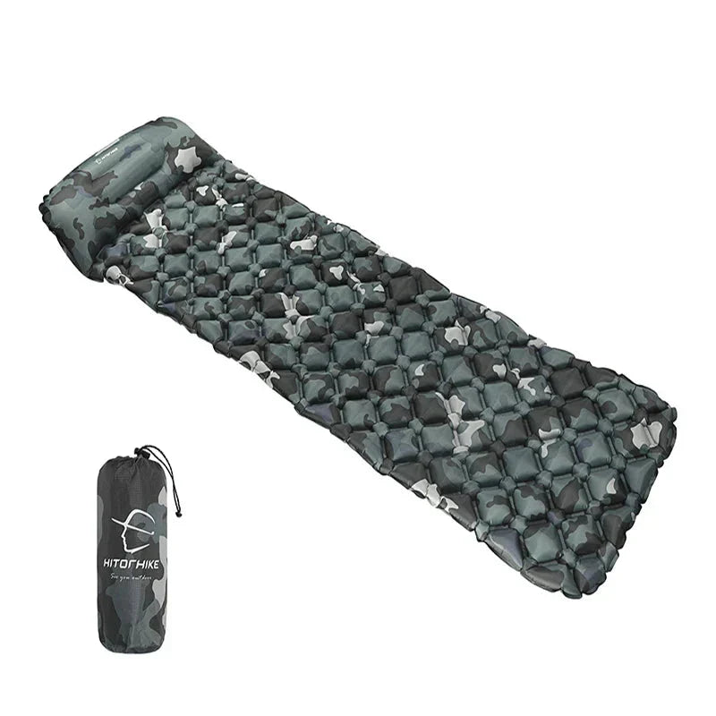 Inflatable sleeping pad with built-in pillow, lightweight nylon camping mattress for outdoor hiking trips.