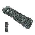 Inflatable sleeping pad with built-in pillow, lightweight nylon camping mattress for outdoor hiking trips.