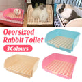Large corner rabbit litter box in plastic with removable mesh grid and high splash walls