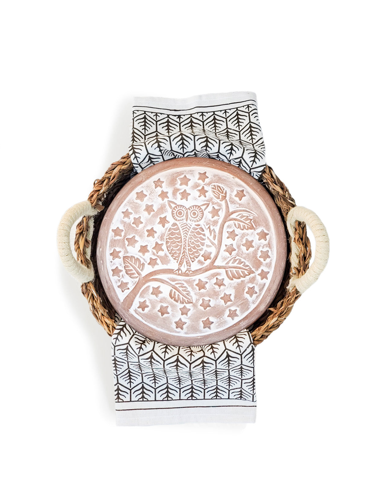 Owl terracotta bread warmer stone in a woven seagrass basket with a printed cotton tea towel — view 5