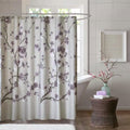 Purple and grey cherry blossom floral pattern cotton shower curtain hanging in a modern bathroom
